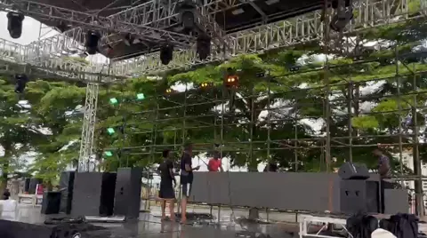 Truss and moving heads rigged over an outdoor stage